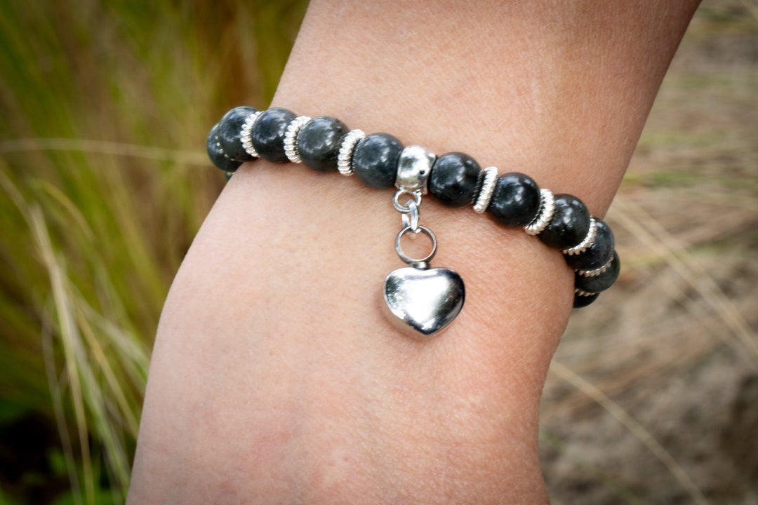 Labradorite keepsake urn heart bracelet with dark beads silver spacers and a silver heart charm.