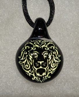 Black glass pendant with a gold lion hologram containing cremation ash on a cord necklace
