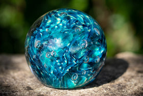 Glass orbs with cremation ash