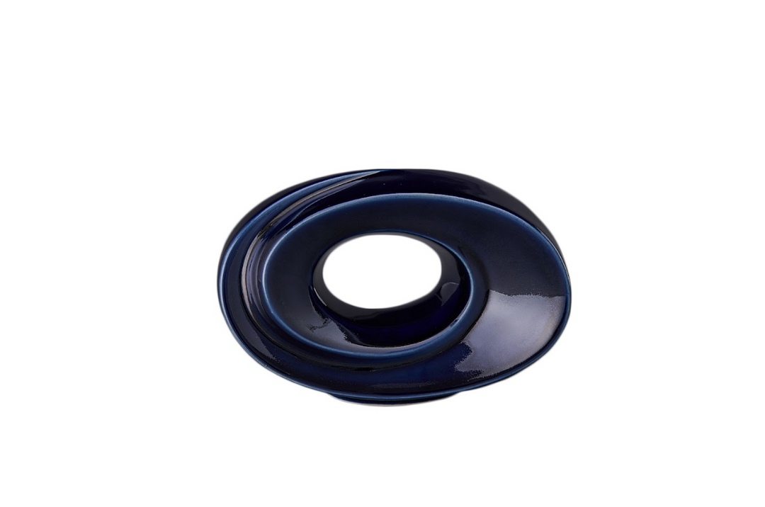 Blue glazed The Passage ceramic urn with a circular hollow center and flowing concentric rings.