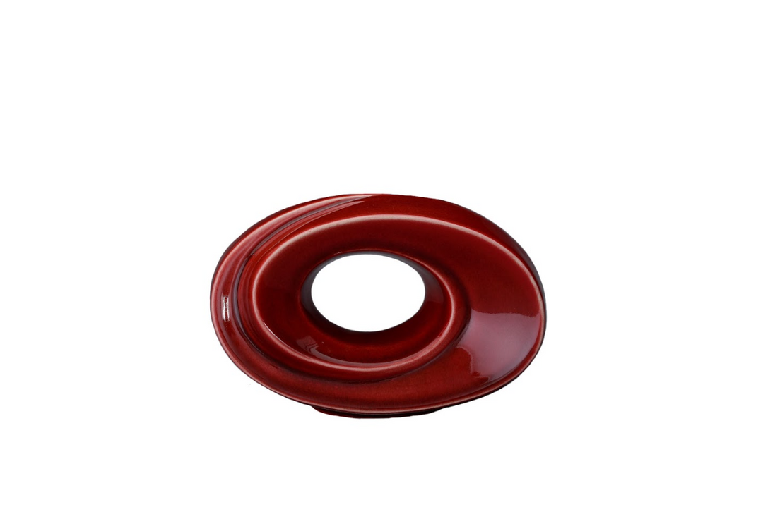 Red glossy ceramic urn with a circular loop design and built in candle holder.