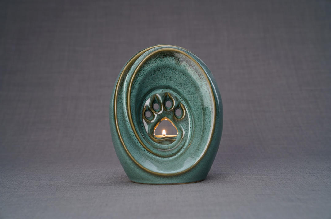 Teal glazed Paw Ceramic Urn with built in candle holder and paw print design.