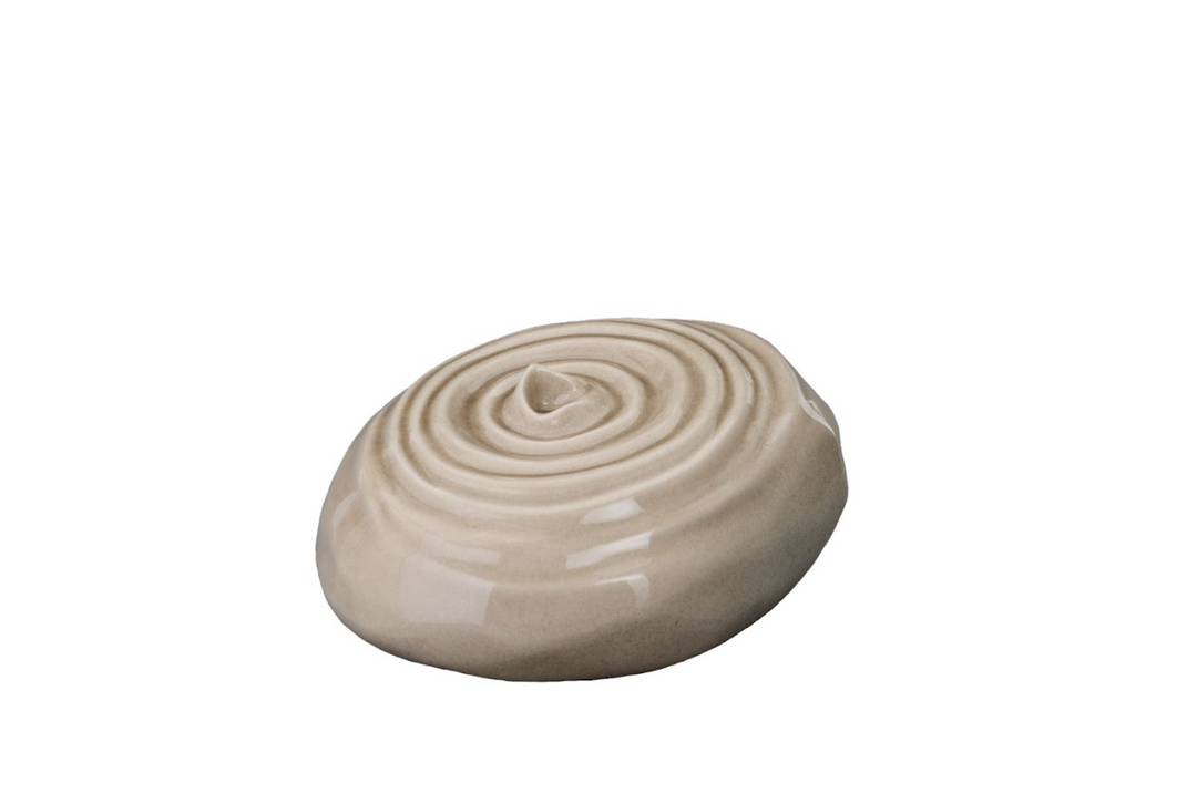 Beige Resonance ceramic urn shaped like a smooth pebble with concentric spiral lid