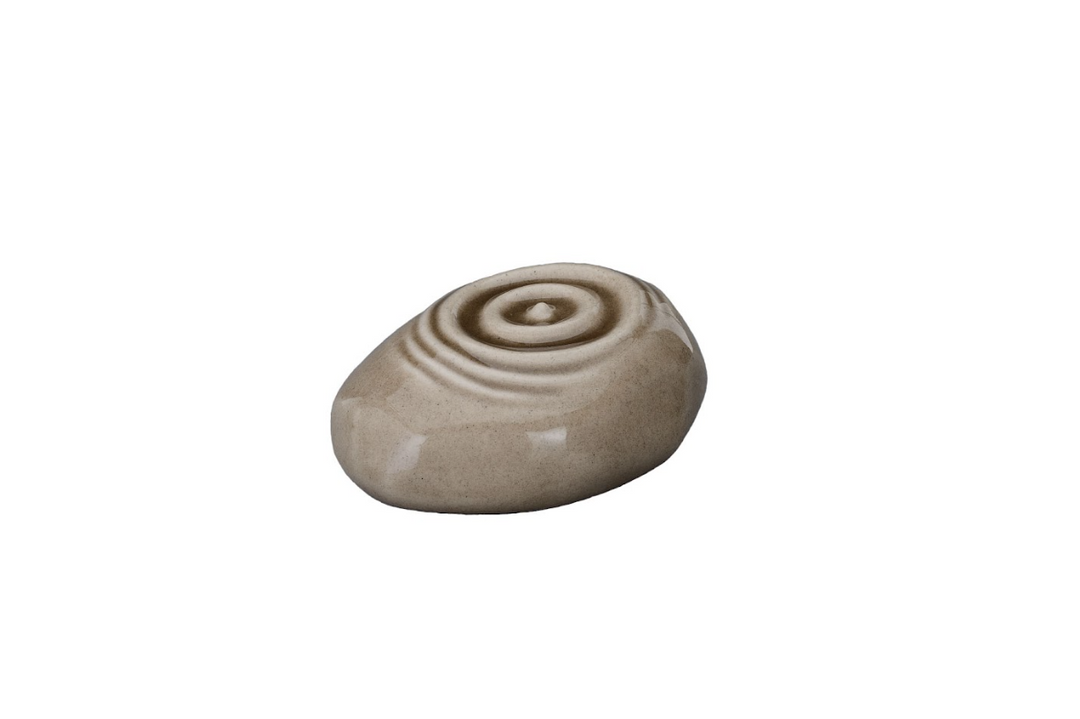 Beige pebble shaped Resonance Ceramic Urn with concentric ripple pattern on the top surface