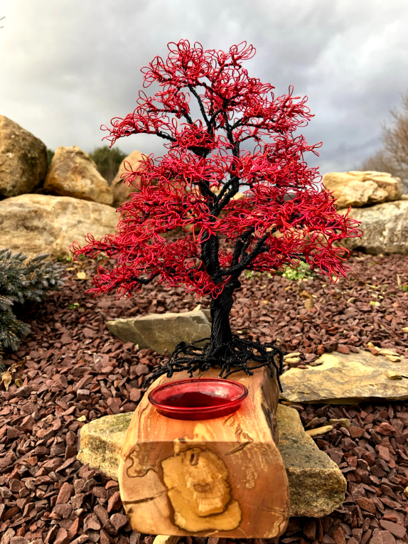Red Maple wire tree on a wooden base with a red glass orb nestled at the base.