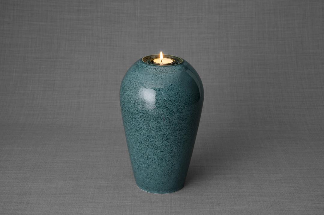 Serenity teal ceramic urn with a built in tea light holder at the top and a soft glossy finish