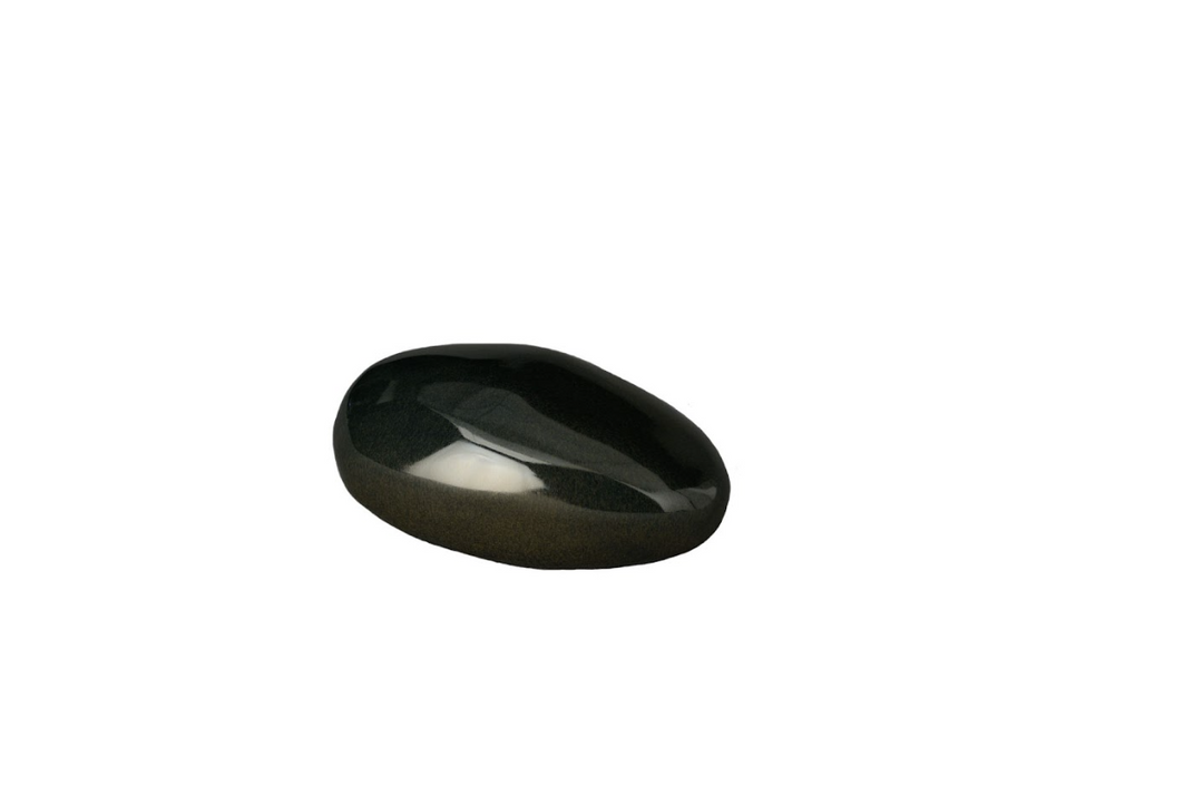 Polished dark oval stone resting on a neutral gray surface