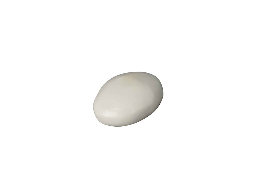 Smooth white stone on a white background