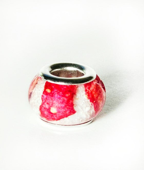 Strawberry cheesecake cremation ash bead with red and white strawberry swirl, designed for Pandora bracelets.