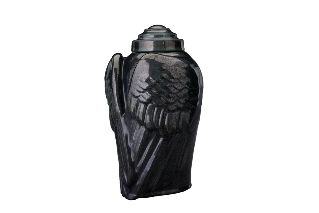 Angels’ Wings Ceramic Urn in bronze tone with detailed feather wings and a rounded lid.