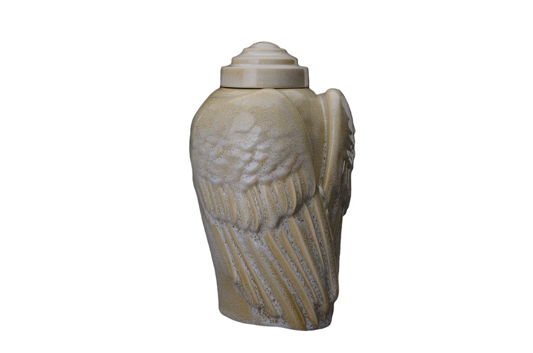 Beige Wings Ceramic Urn with a layered lid and sculpted feather wings.