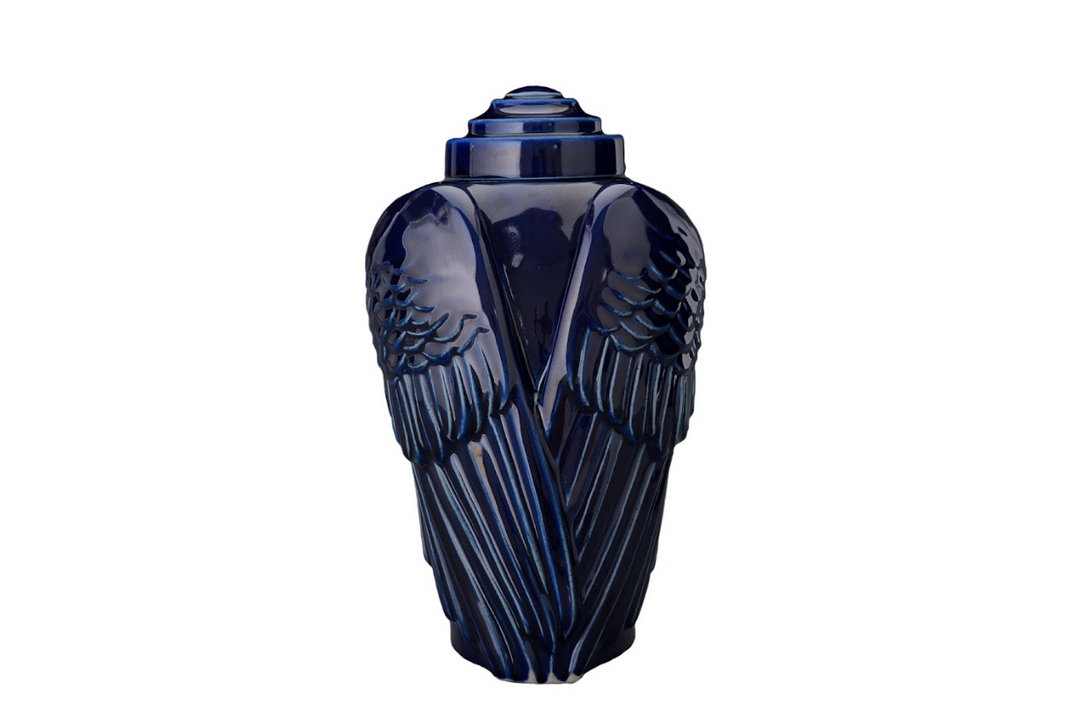 Deep cobalt Wings Ceramic Urn with lid, featuring bold feathered wings around the vessel.