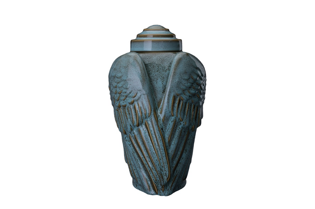 Teal Wings Ceramic Urn with lid, showing textured feather details and a blue teal glaze.