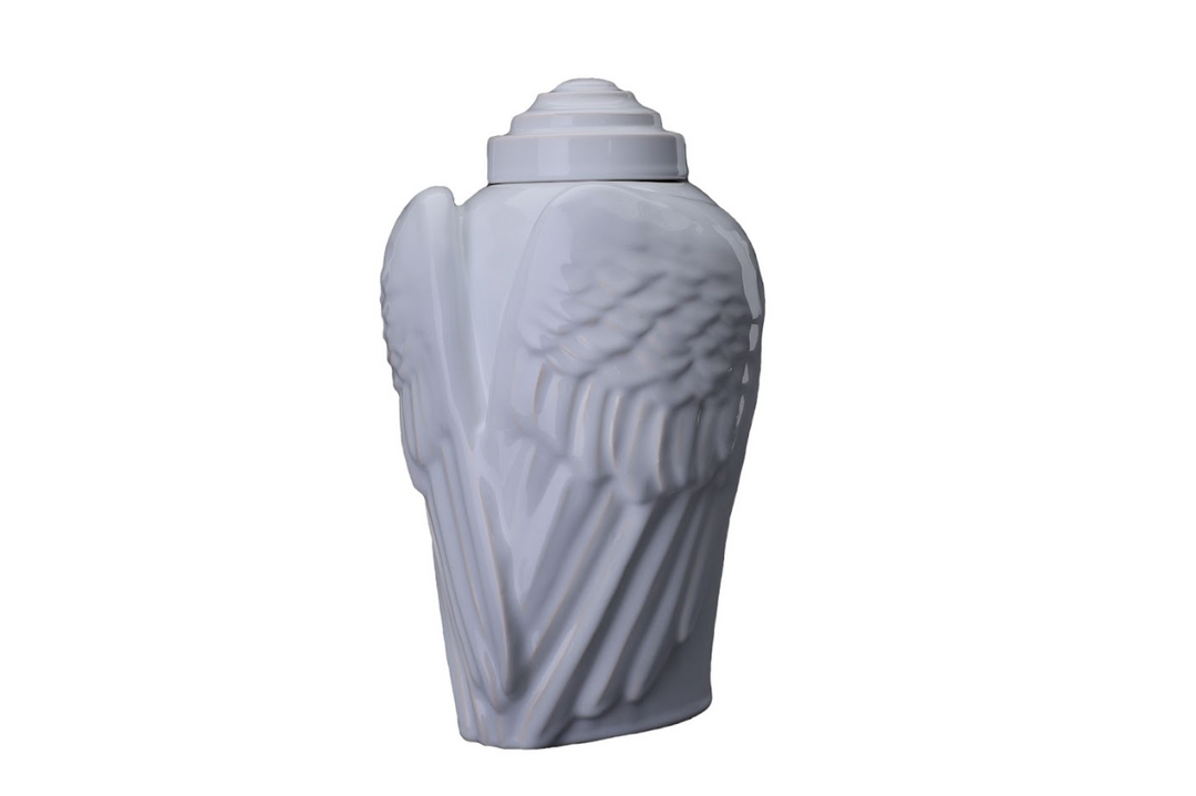 White Wings Ceramic Urn with sculpted wing details and a tiered lid.