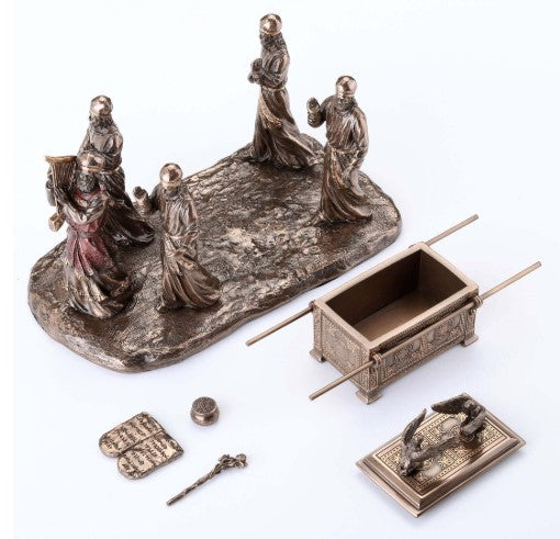 Angled view of the Ark of the Covenant keepsake urn with four standing figures around the chest on a rugged base