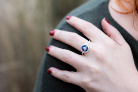 women wearing bedazzled opal ring with cremation ash