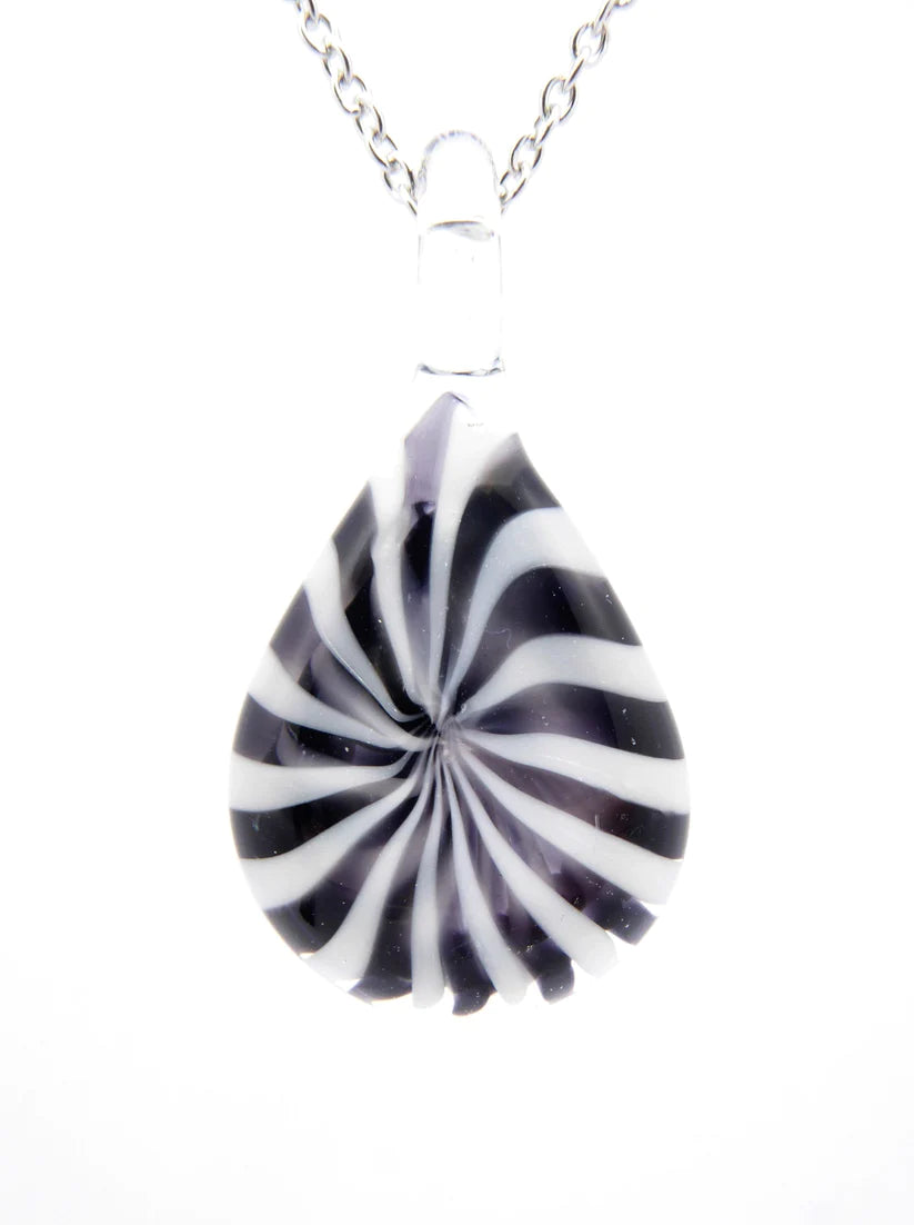 Teardrop shaped glass pendant with black and white swirl pattern on a white background.