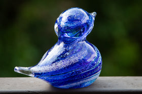 glass blue bird with cremation ash