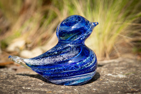 glass blue bird with cremation ash