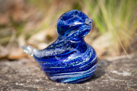 glass blue bird with cremation ash