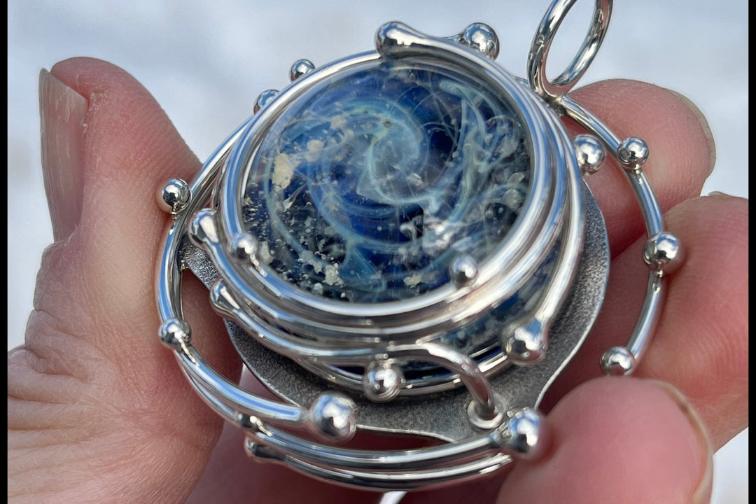 caged galaxy pendant with cremation ash