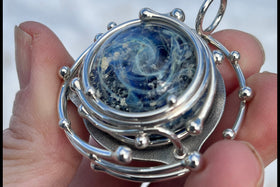 caged galaxy pendant with cremation ash