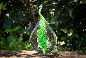 glass flame with cremation ash from pets and people