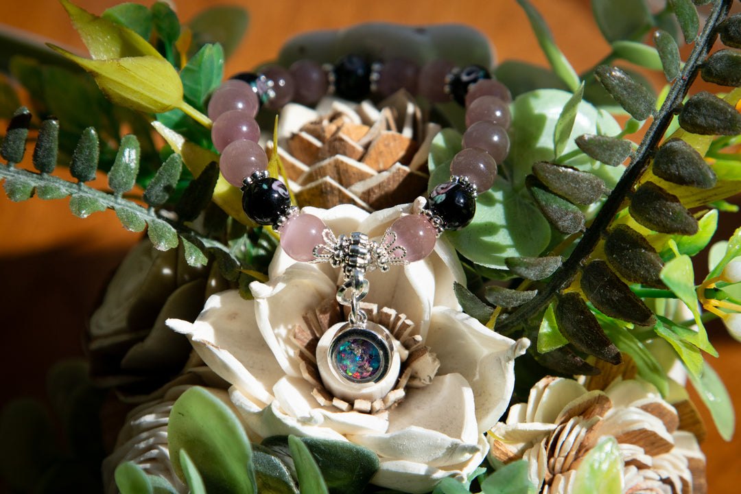black flower bracelet with cremation ash