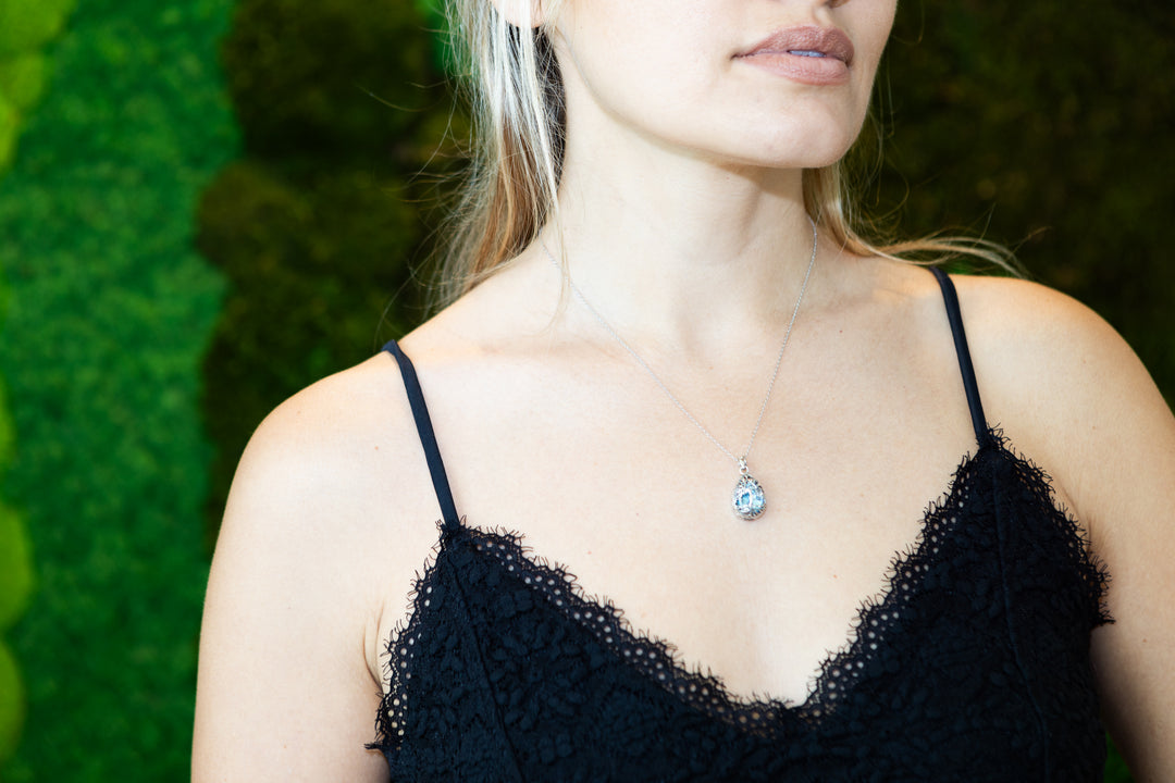 tree of life crystal pendant with cremation ash being worn by woman