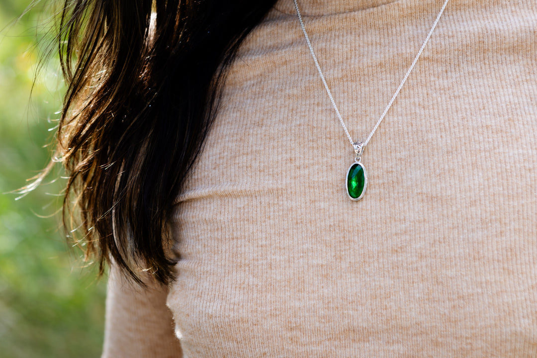long pendant with cremation ash worn on woman