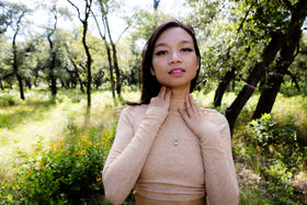 women wearing keepsake necklace