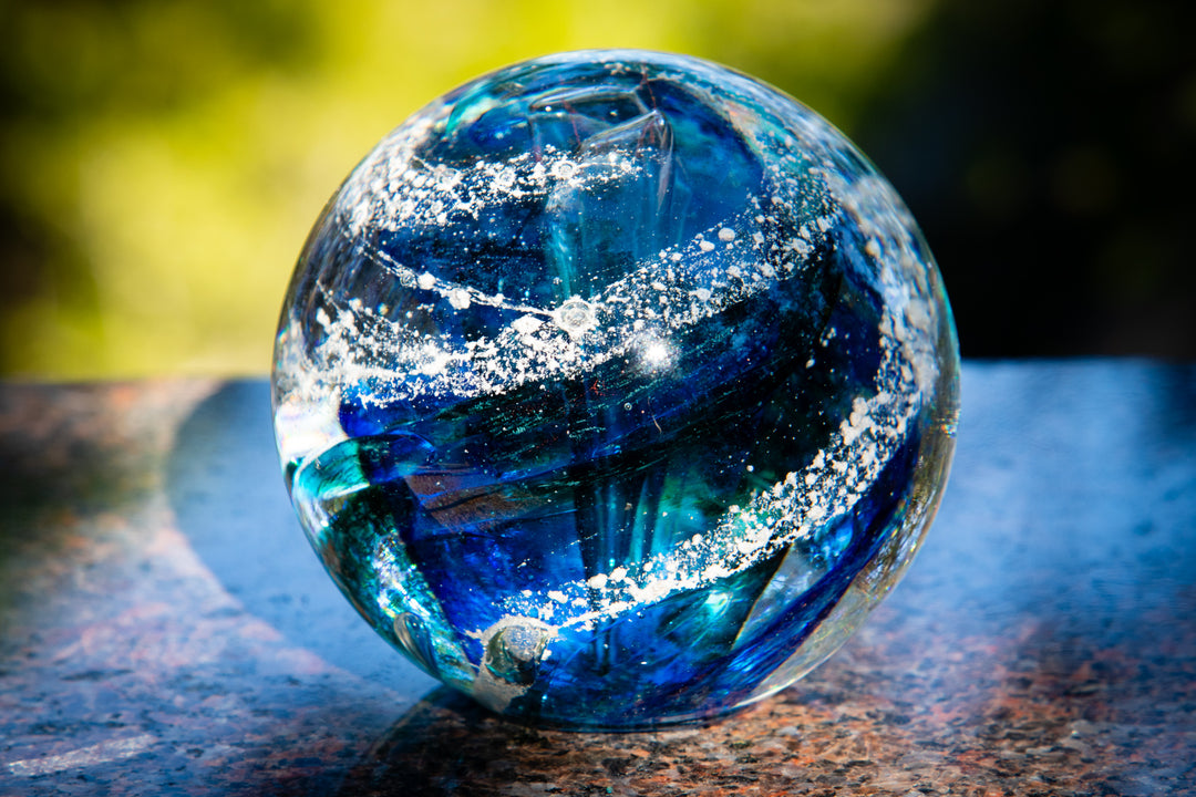 Autumn Sunshine Tree Of Life with Tranquil Swirl Orb close-up blue teal orb on a stone surface