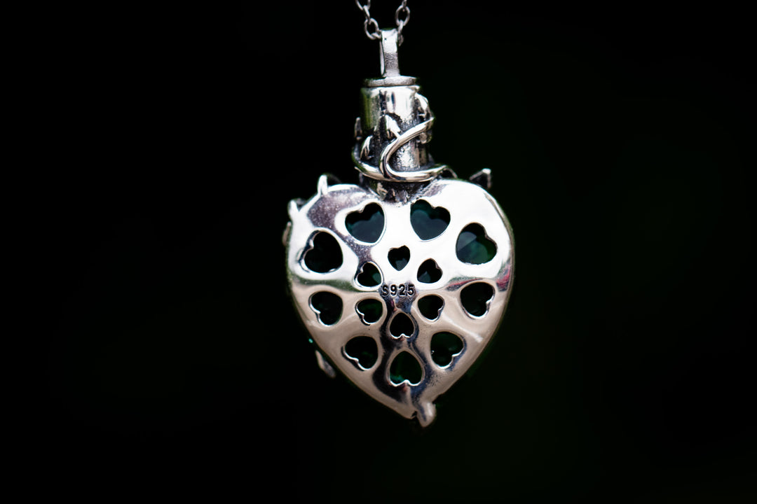emerald green cremation jewelry with silver flower