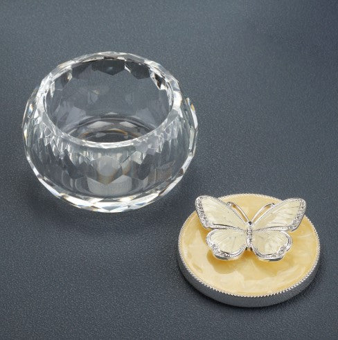 Faceted crystal butterfly keepsake urn with its butterfly lid beside the base.