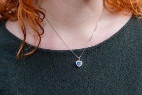 woman wearing dainty sterling silver heart pendant