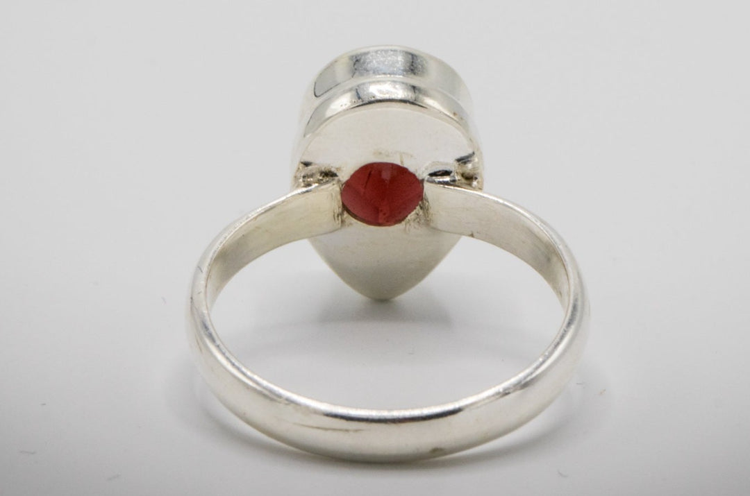 Sterling silver Garnet Ring with cremation ashes embedded beneath the gemstone for a memory keepsake