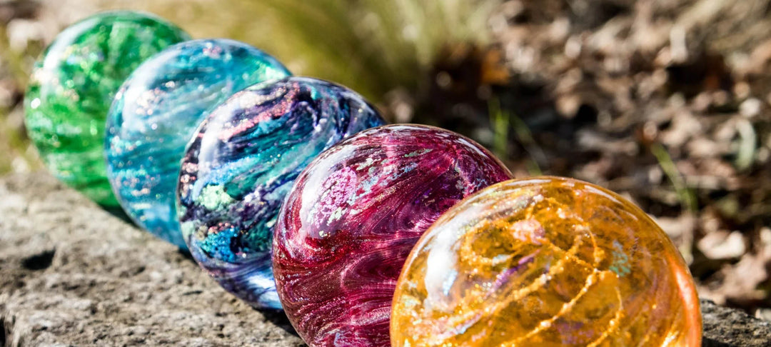 Colorful glass marbles on a natural surface