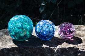 Glass orbs with cremation ash