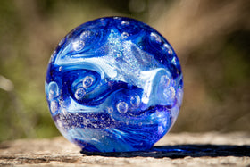 Glass orbs with cremation ash