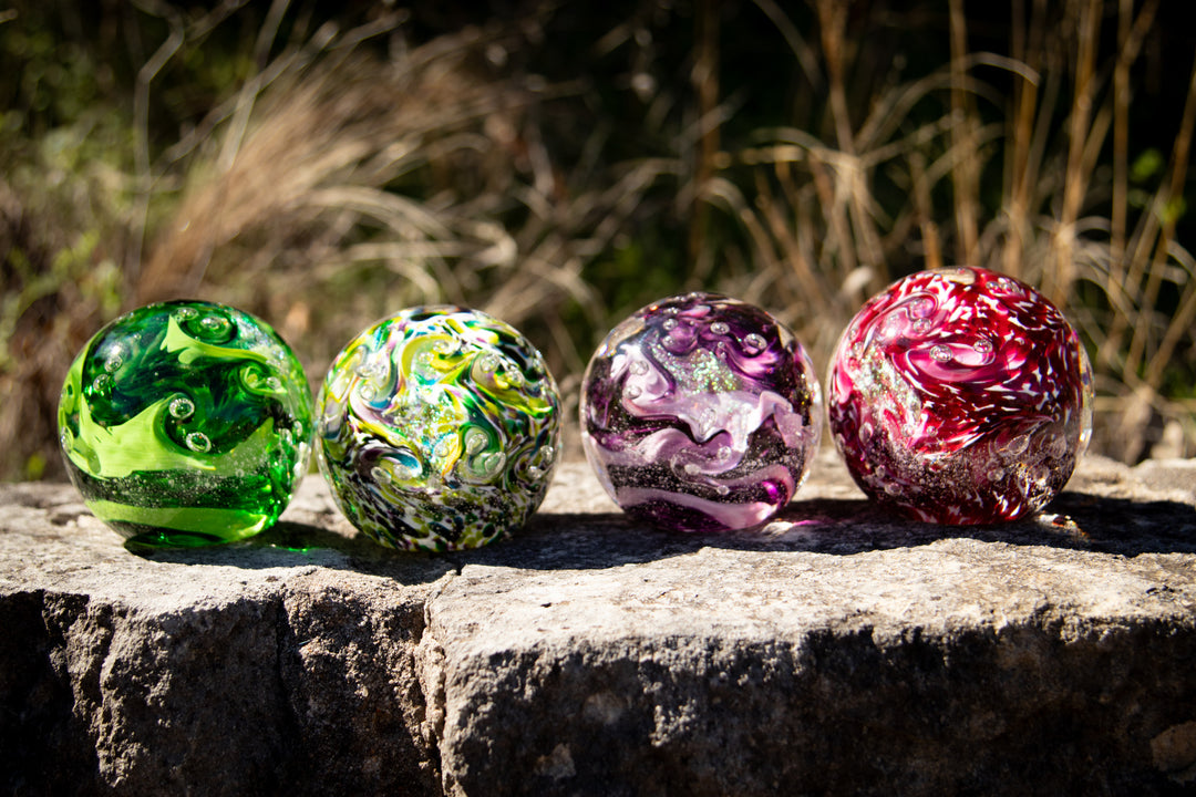 Glass orbs with cremation ash