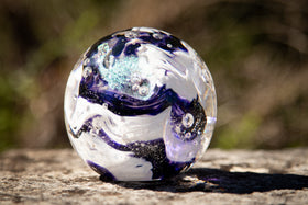 Glass orbs with cremation ash