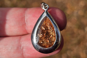 sterling silver keepsake pendant holding hair or fur, perfect for keepsake pendants for pets or baby's first haircut