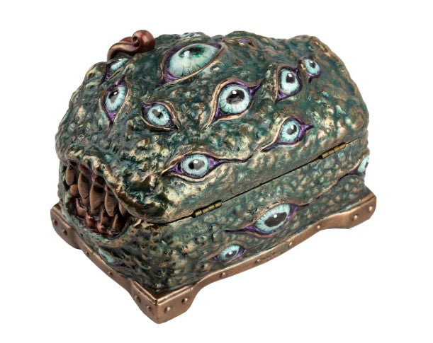 Close up of teal bronze mimic urn head covered in multiple eyes and a curling tongue.