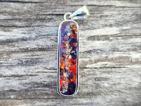 long rounded pendant with cremation ash