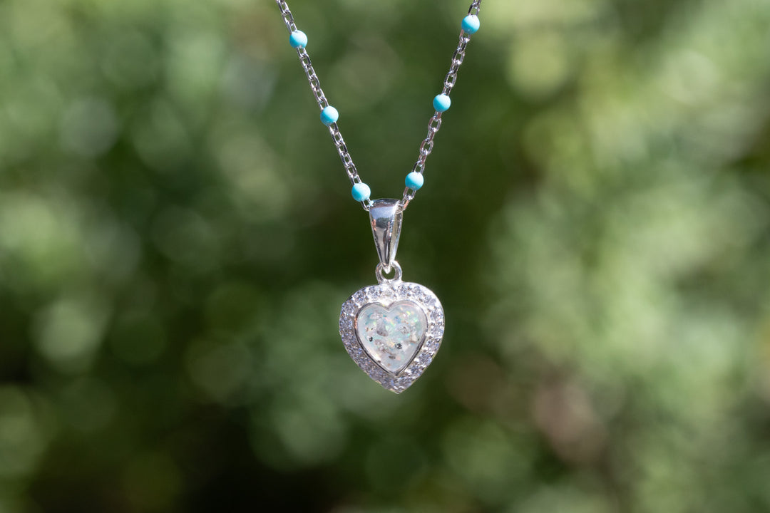 Opal heart pendant with crystal border on an enamel beaded chain featuring tiny turquoise beads