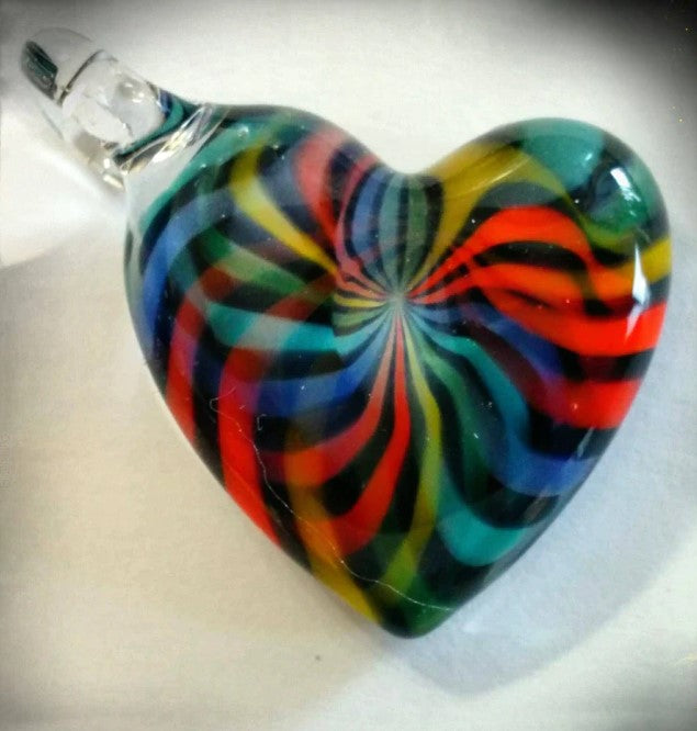 Circular glass pendant with a rainbow color wheel swirl design on a silver chain