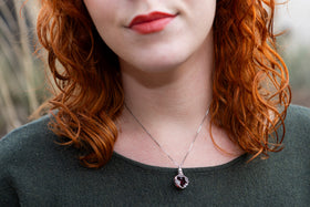women wearing ruby heart cremation pendant