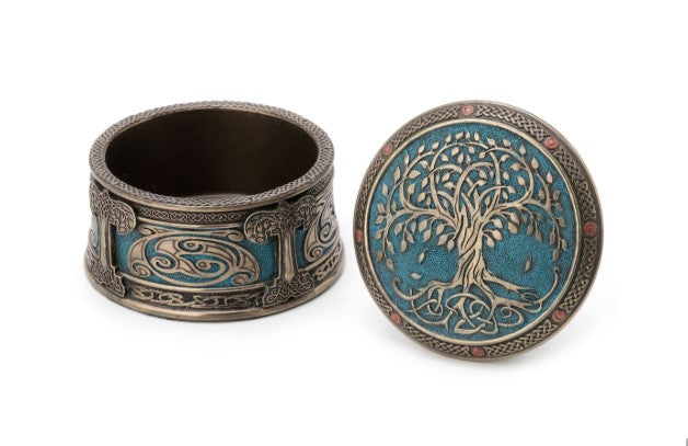 Open round Tree of Life keepsake urn with lid removed, teal blue lid featuring the tree and knotwork