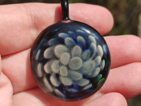 flower implosion pendant with cremation ash