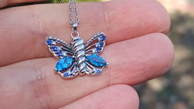video of butterfly keepsake urn necklace in hand